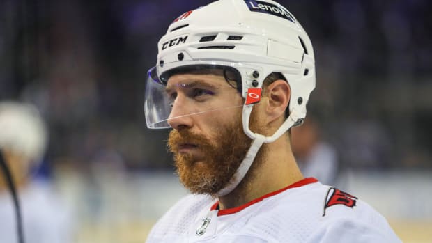 May 24, 2022; New York, New York, USA; Carolina Hurricanes defenseman Ian Cole (28) talks with coaches during the third period against the New York Rangers in game four of the second round of the 2022 Stanley Cup Playoffs at Madison Square Garden. Mandatory Credit: Danny Wild-USA TODAY Sports